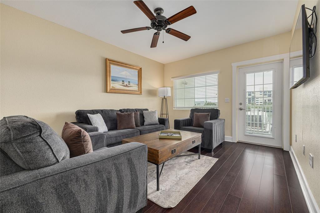 399 2nd Street, Unit 219 Indian Rocks Beach, FL 33785 - Photo 13 of 46 a living room with furniture and a window