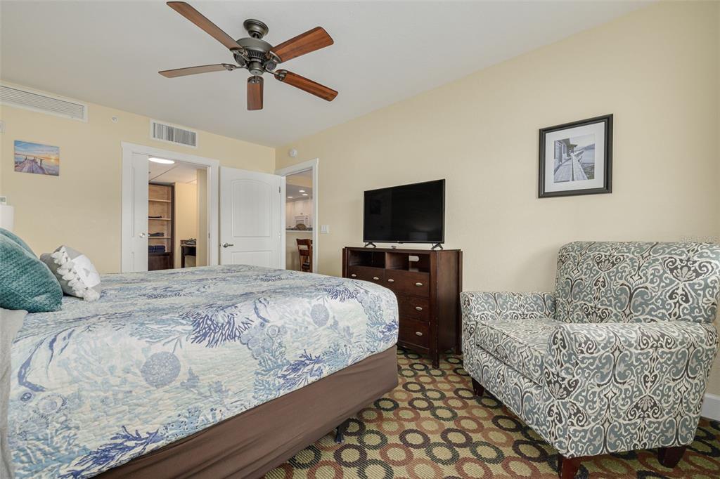 399 2nd Street, Unit 219 Indian Rocks Beach, FL 33785 - Photo 23 of 46 a bedroom with a bed and a couch