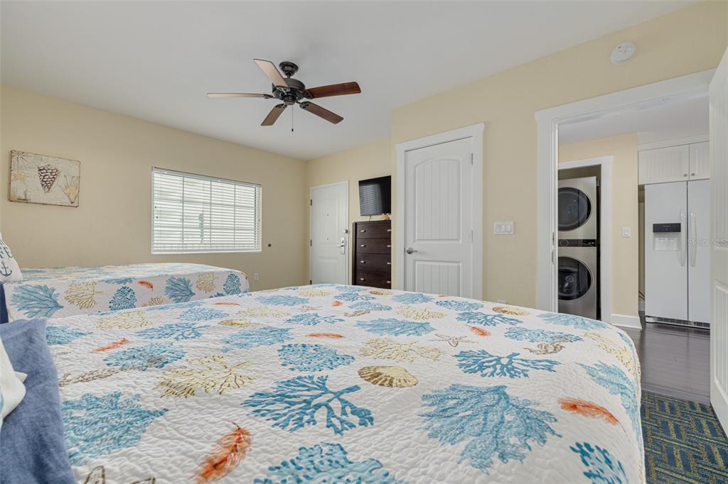 399 2nd Street, Unit 219 Indian Rocks Beach, FL 33785 - Photo 27 of 46 a bedroom with a bed and a dresser