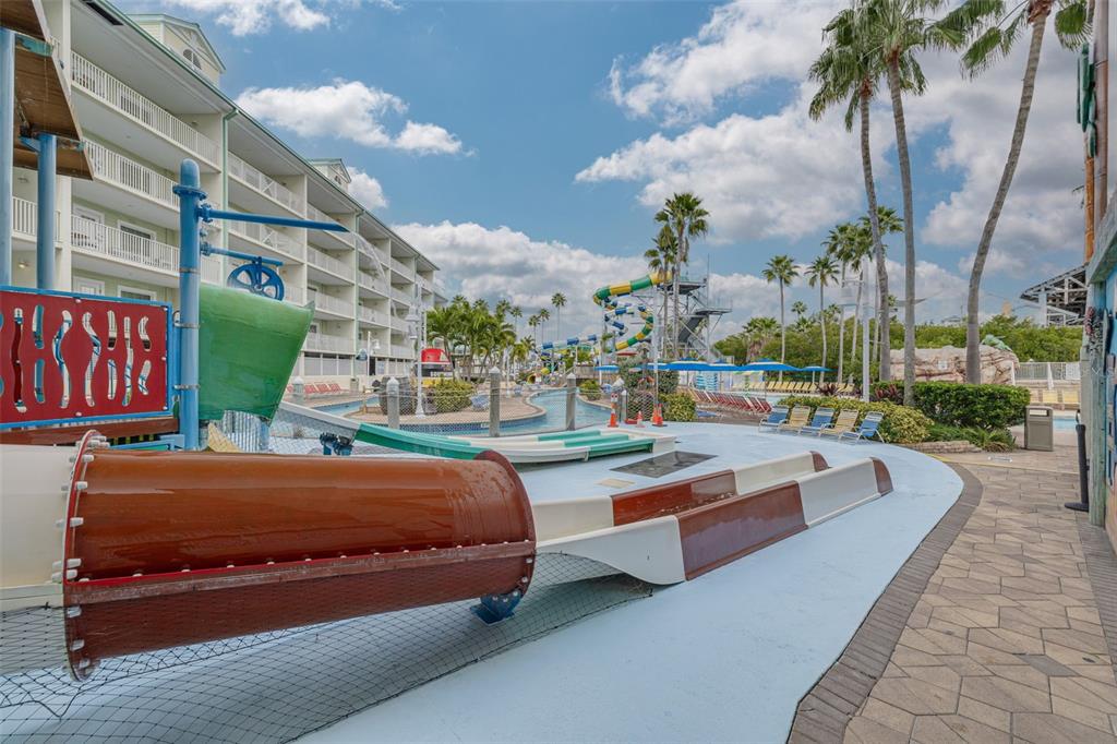 399 2nd Street, Unit 219 Indian Rocks Beach, FL 33785 - Photo 36 of 46 a outdoor space with the couches and palm trees