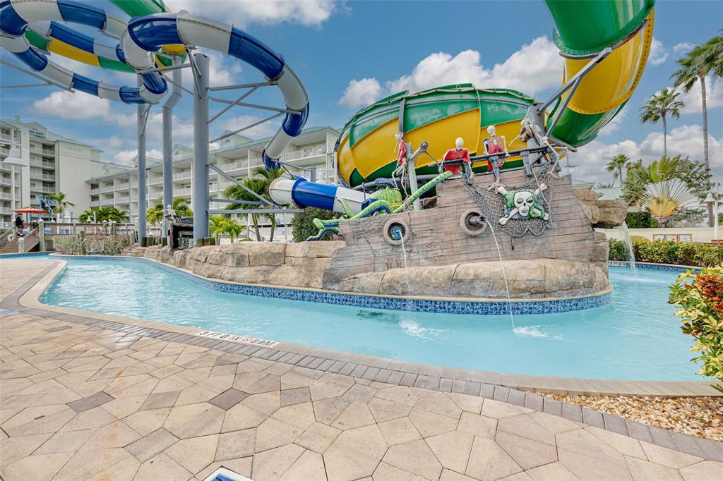 399 2nd Street, Unit 219 Indian Rocks Beach, FL 33785 - Photo 40 of 46 a view of a swimming pool with a sitting space