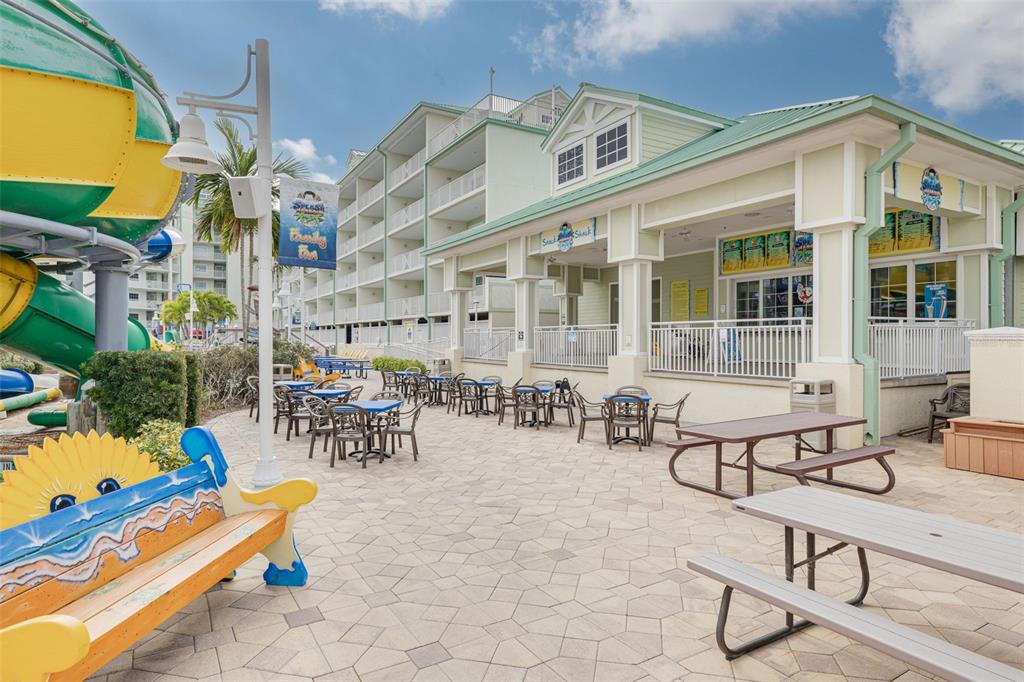 399 2nd Street, Unit 219 Indian Rocks Beach, FL 33785 - Photo 41 of 46 a view of a house with swimming pool and sitting area
