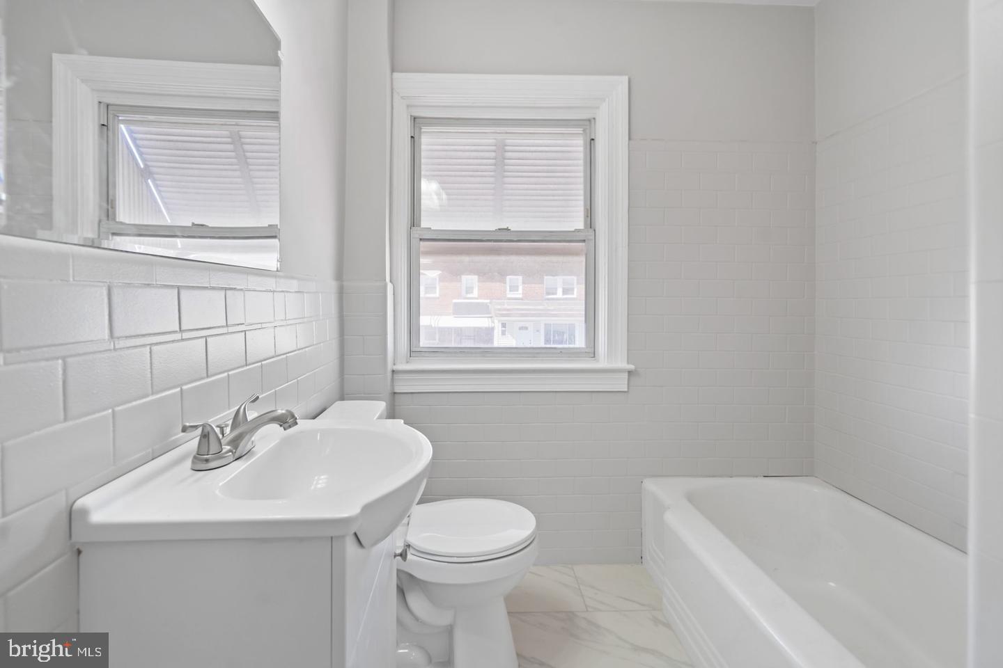 5 North Rosedale Street Baltimore, MD 21229 - Photo 6 of 11 a bathroom with a sink toilet and tub