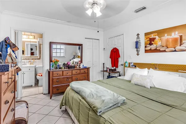 a bedroom with a bed and dresser