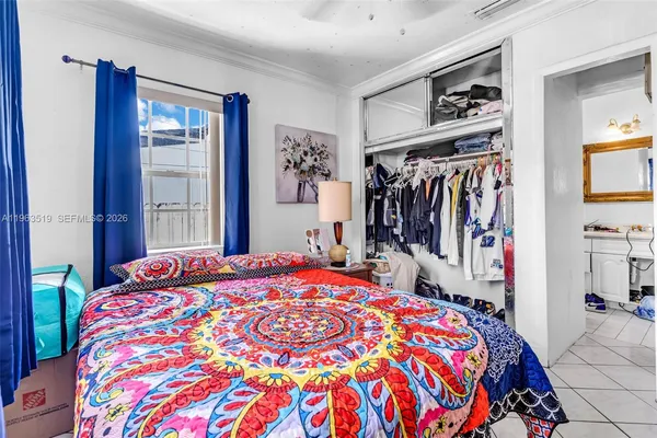 a kitchen with stainless steel appliances kitchen island granite countertop a refrigerator and a stove top oven