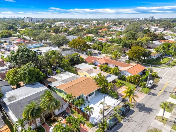 an aerial view of residential houses with outdoor space