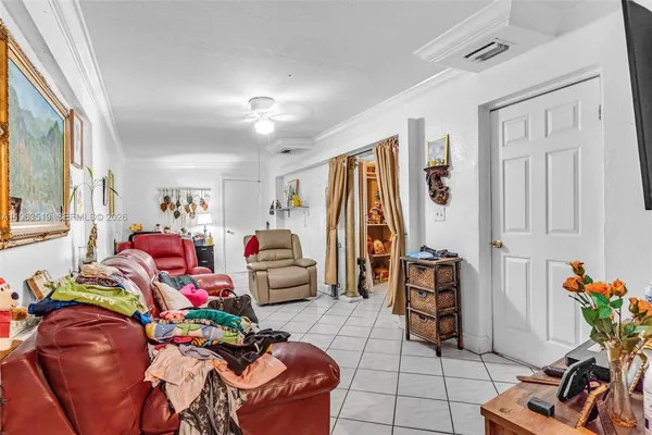 a living room filled with furniture and a table