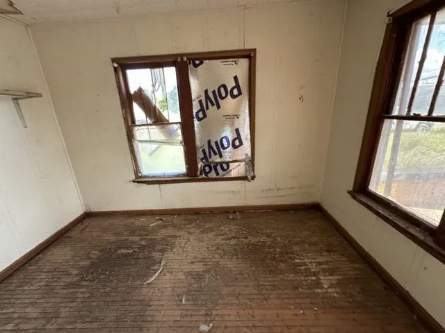 a bathroom with a tub shower and a sink