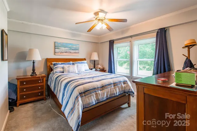 a bed room with a bed and a chandelier