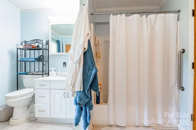 a bathroom with a sink toilet and a shower