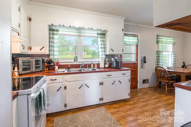 a spacious bathroom with double vanity and a large mirror