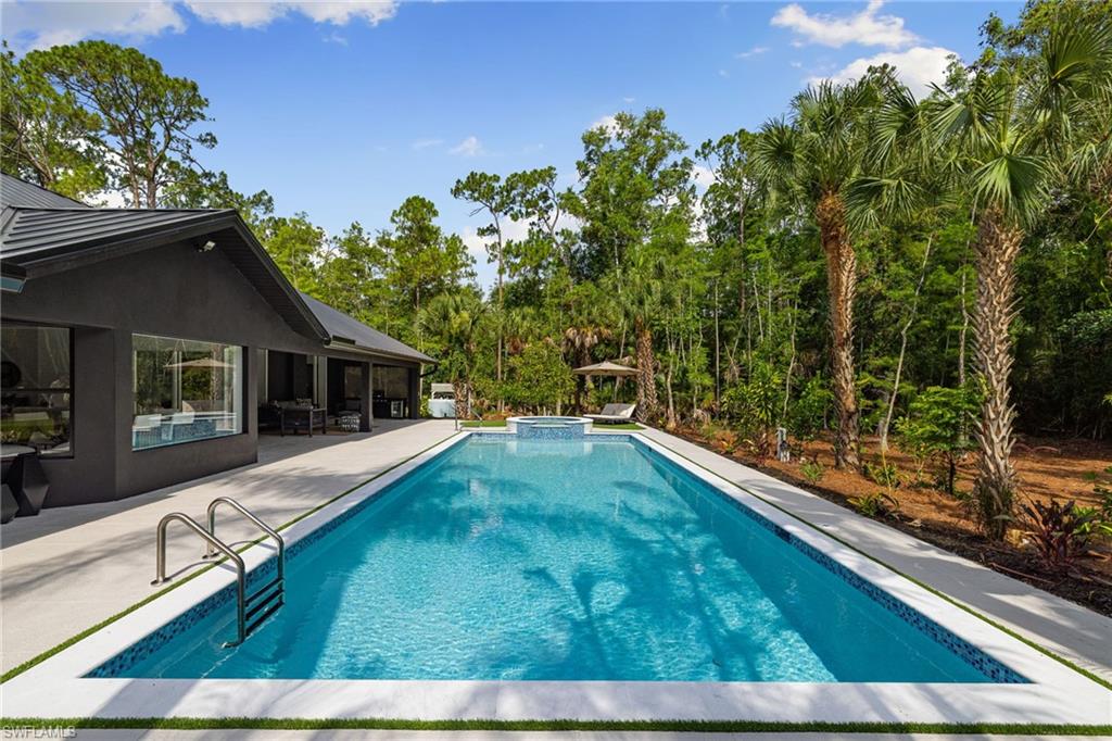 4521 3rd Avenue Northwest Naples, FL 34119 - Photo 29 of 46 a view of house with yard entertaining space
