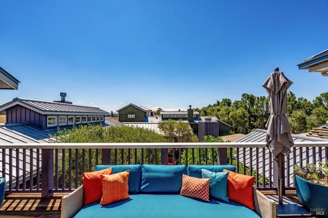 a view of a swimming pool with an outdoor seating and a yard
