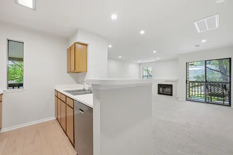 an empty room with closet and entryway