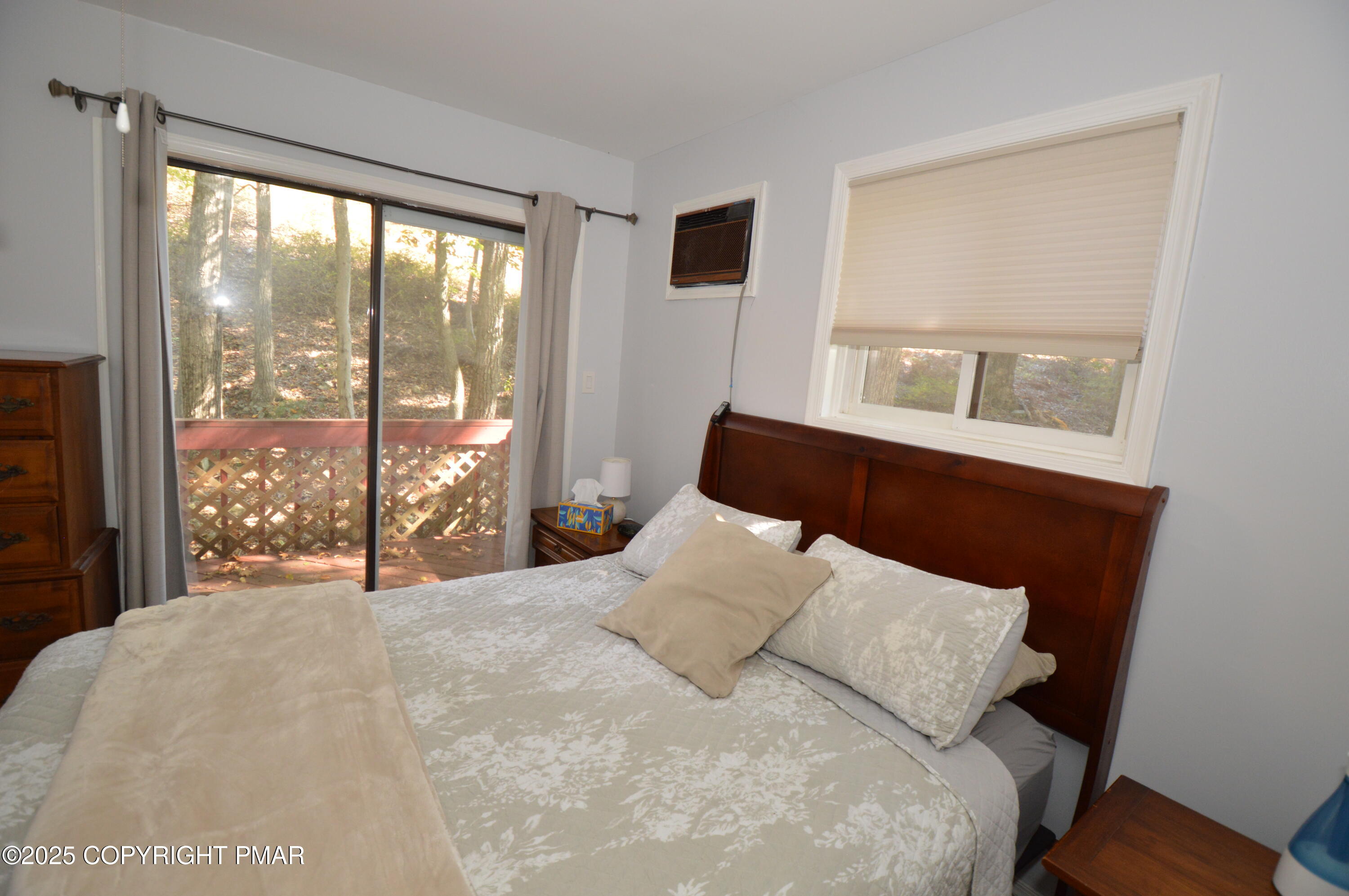 128 Ashley Court Bushkill, PA 18324 - Photo 8 of 43 a bedroom with a large bed and a large window