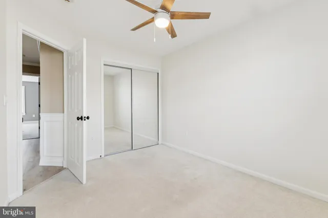 an empty room with fan