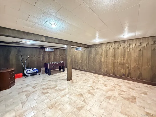 a view of an empty room with wooden walls