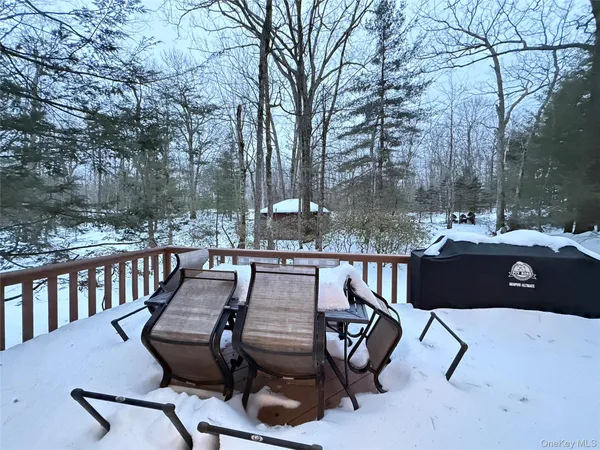 a view of a house with a wooden fence