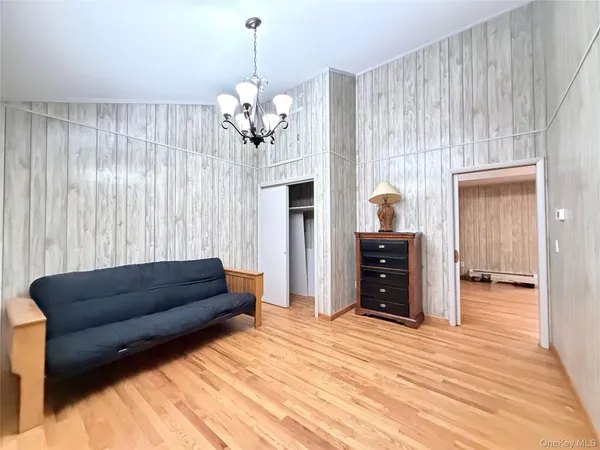 a living room with a couch and a chandelier