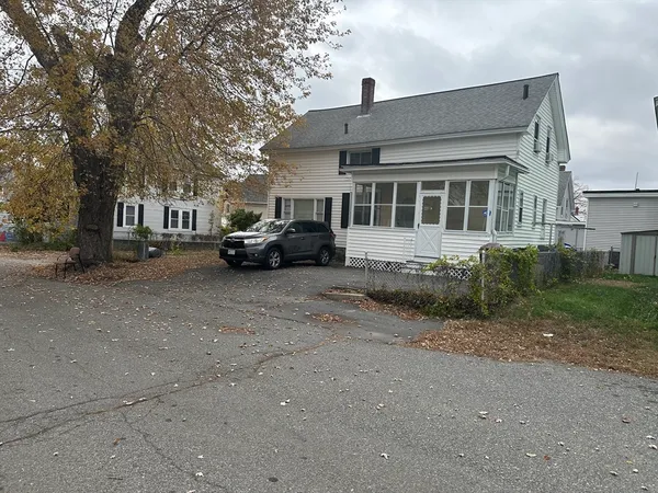 a car parked in front of a house