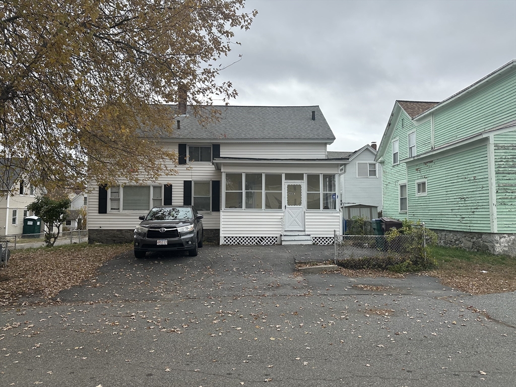 48 E Street Lowell, MA 01851 - Photo 14 of 14 a car parked in front of a house