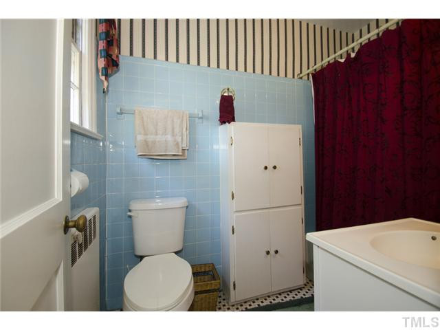 1324 Canterbury Road Raleigh, NC 27608 - Photo 9 of 16 Master bath with tile floor and tub/shower. Master Bath/Spa