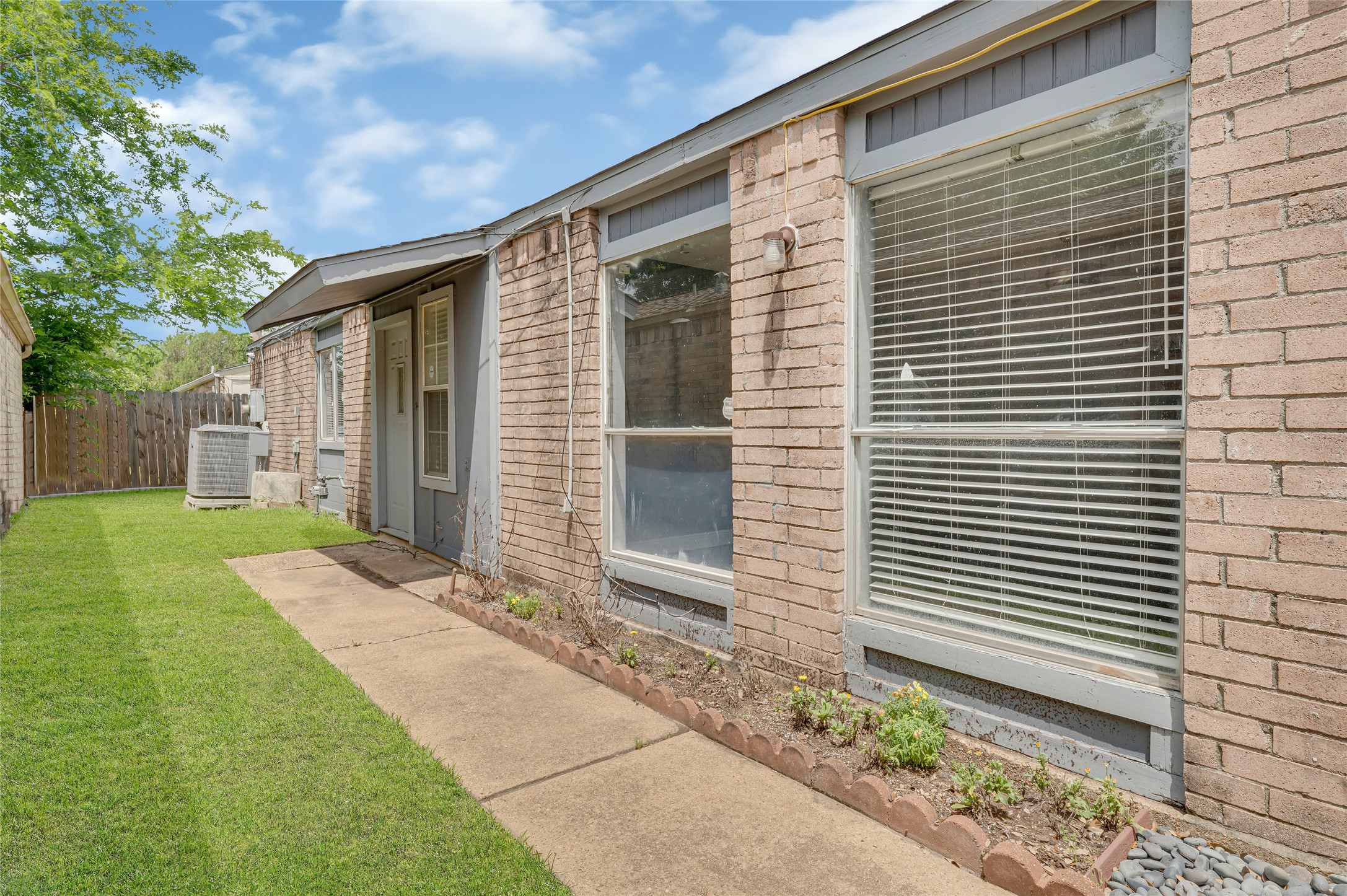 4170 Amir Street Houston, TX 77072 - Photo 16 of 18 a front view of a house with garden
