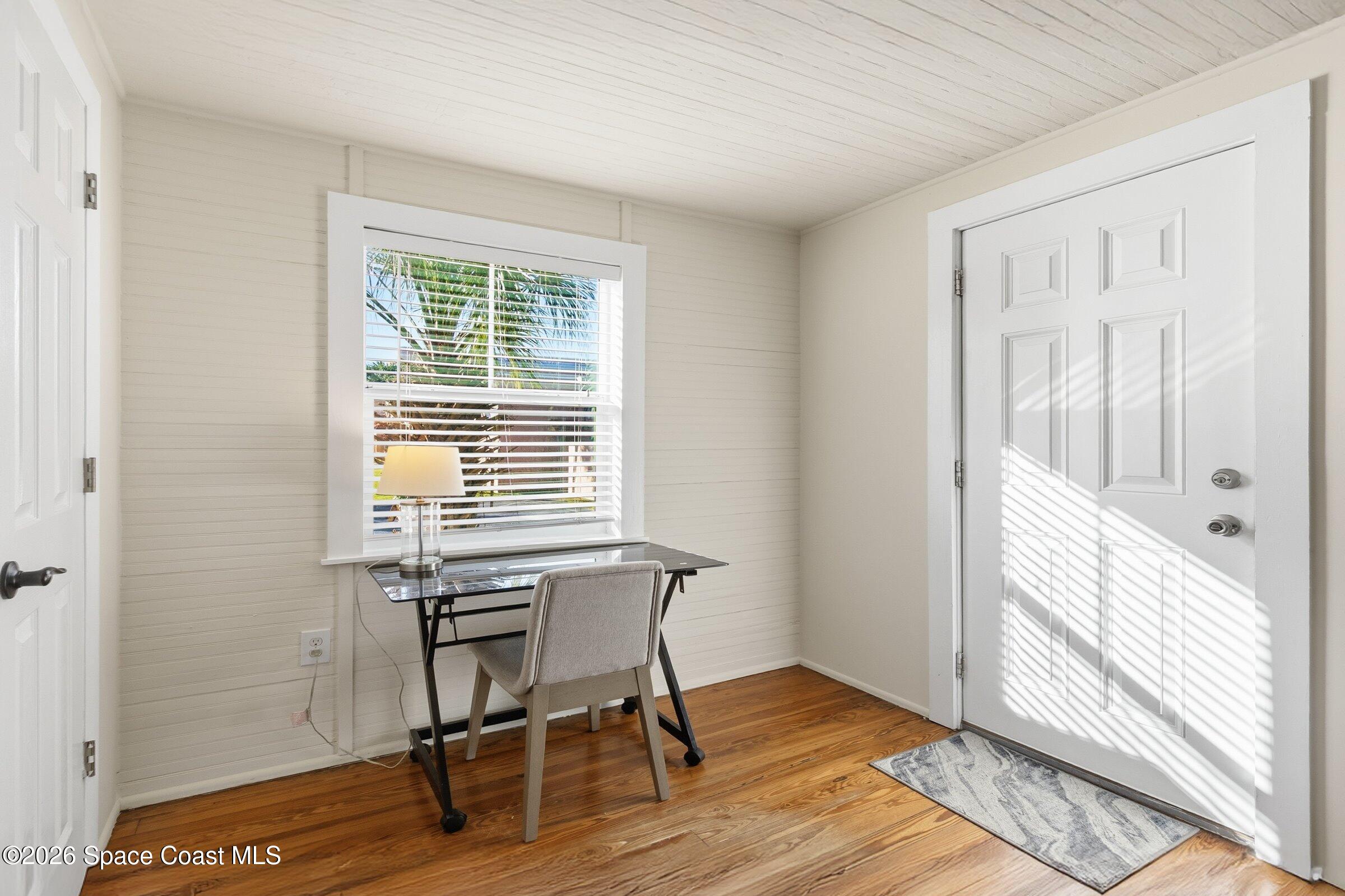 11 Mitchell Street Cocoa, FL 32922 - Photo 128 of 159 a view of a workspace with wooden floor and a window
