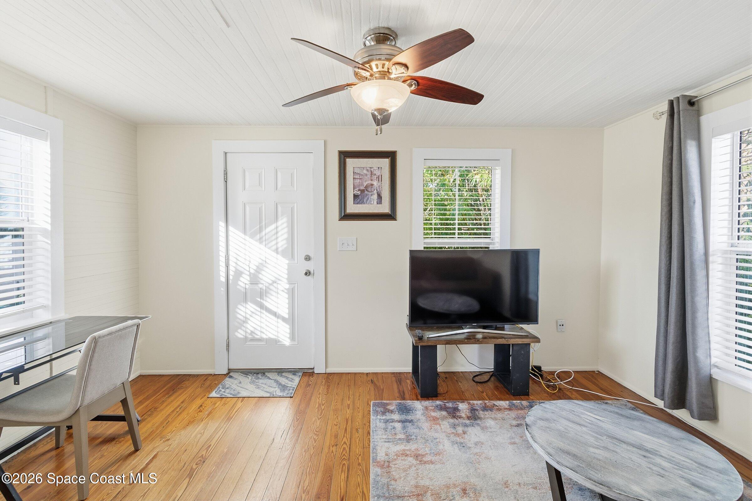 11 Mitchell Street Cocoa, FL 32922 - Photo 131 of 159 a living room with furniture and a flat screen tv