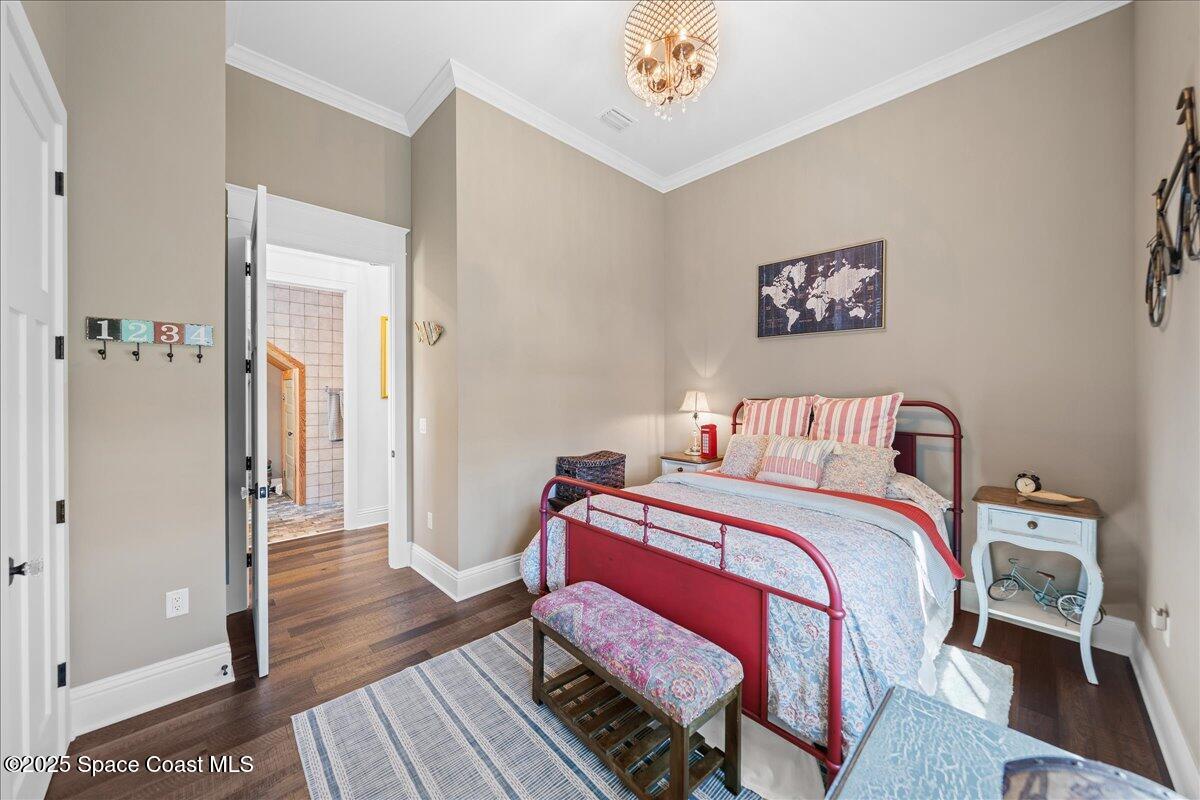 11 Mitchell Street Cocoa, FL 32922 - Photo 26 of 159 a bedroom with a bed and a table in it