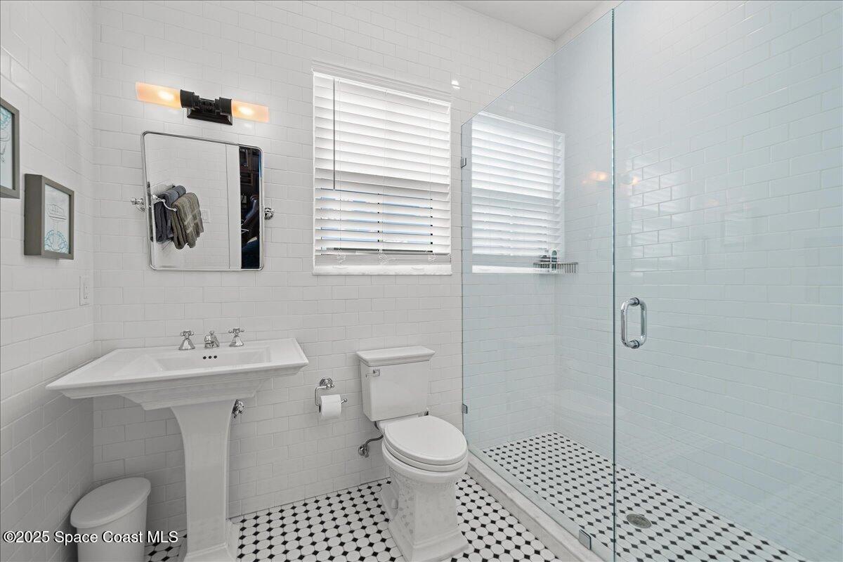 11 Mitchell Street Cocoa, FL 32922 - Photo 36 of 159 a bathroom with a sink toilet and shower