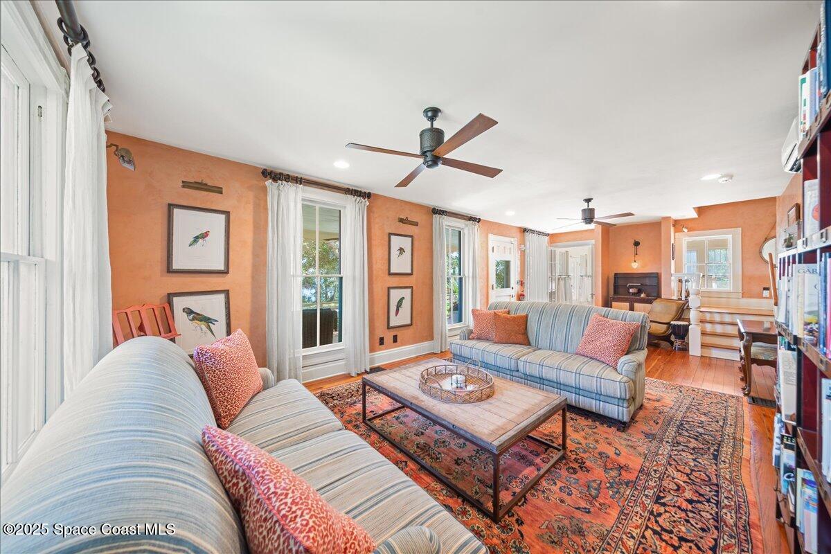 11 Mitchell Street Cocoa, FL 32922 - Photo 62 of 159 a living room with furniture a table and a large window