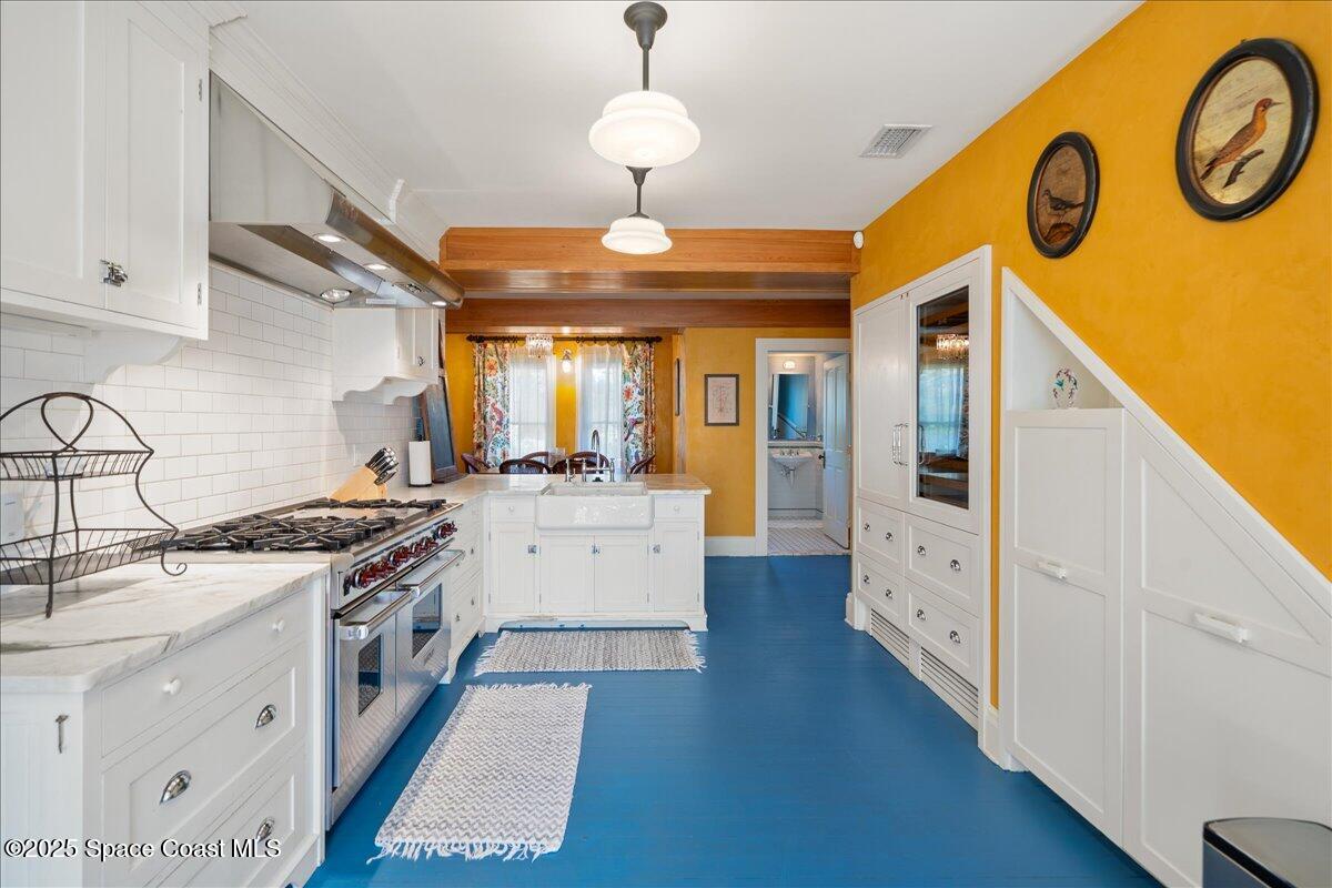 11 Mitchell Street Cocoa, FL 32922 - Photo 69 of 159 a kitchen with a stove oven and a table