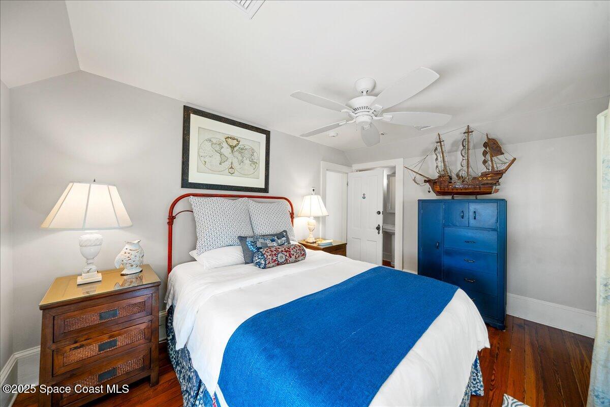 11 Mitchell Street Cocoa, FL 32922 - Photo 85 of 159 a bedroom with a bed and a lamp on table