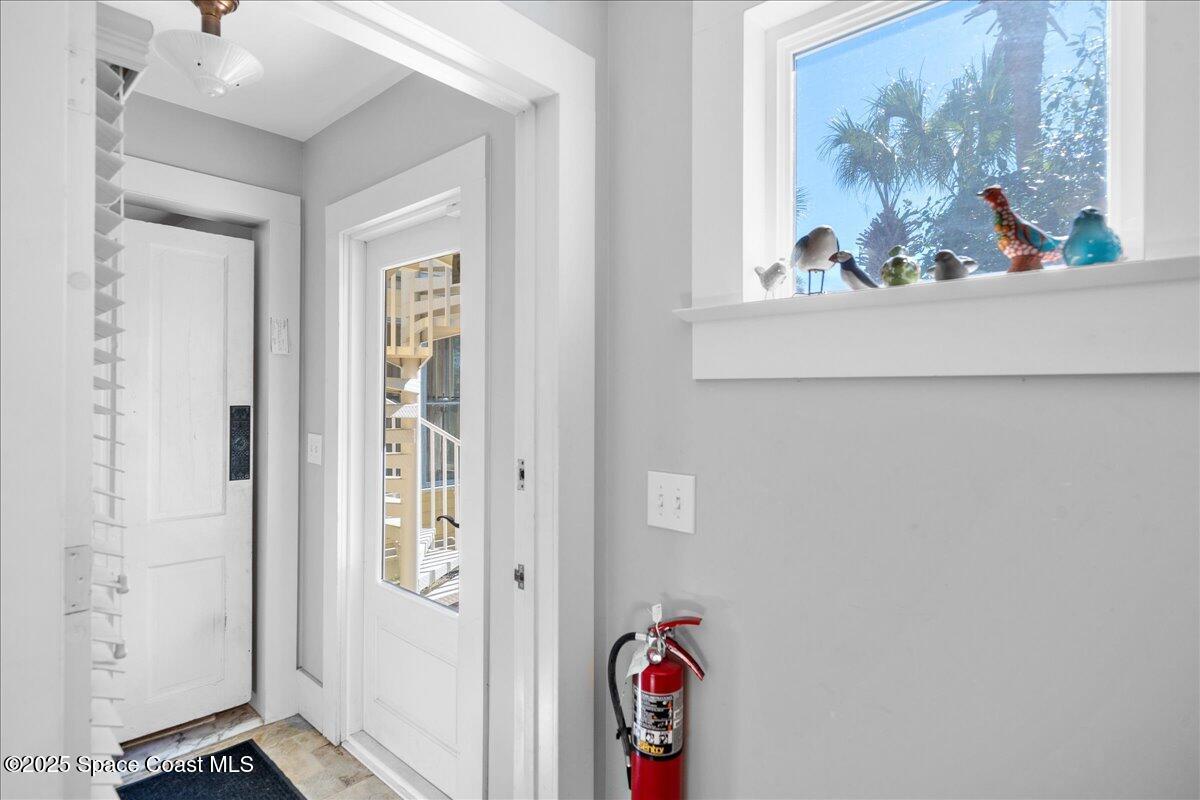 11 Mitchell Street Cocoa, FL 32922 - Photo 95 of 159 a view of a hallway with a painting on the wall