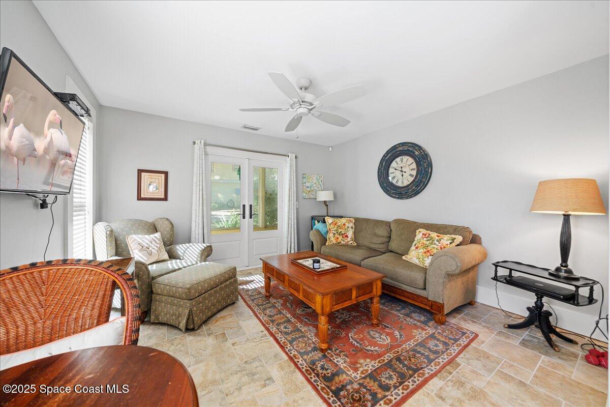 11 Mitchell Street Cocoa, FL 32922 - Photo 96 of 159 a living room with furniture a rug and a window