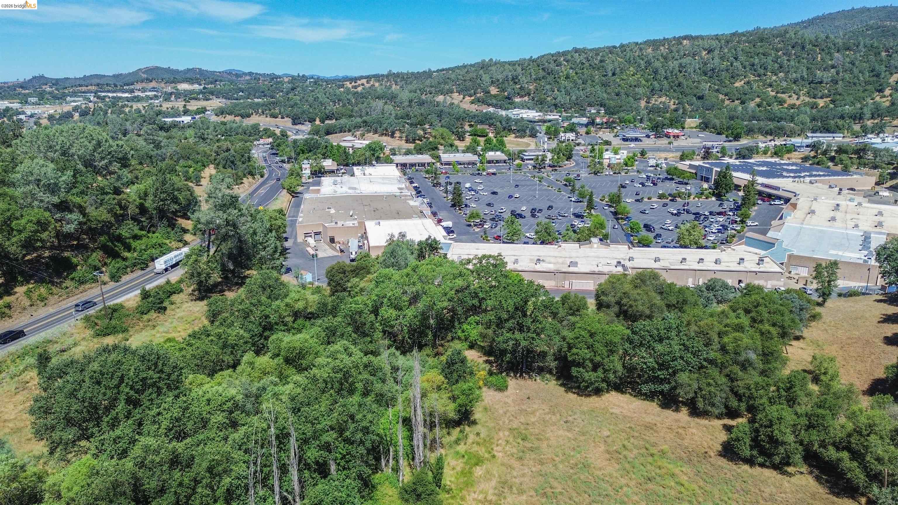 13904 Tuolumne Road Sonora, CA 95370 - Photo 5 of 44 Commercial property featuring expansive parking facilities and multiple retail structures