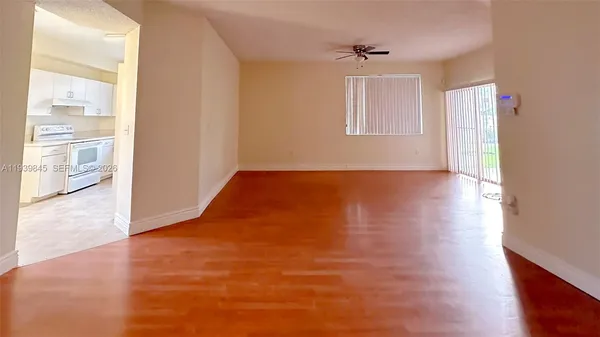 a view of an empty room with a window