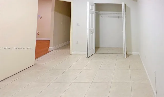 an empty room with entrance door