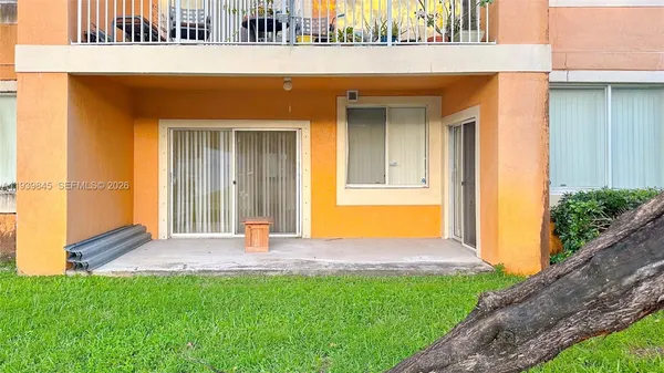 a view of front door of house with yard