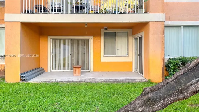 a view of front door of house with yard