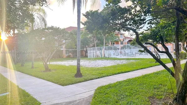 a view of a house with a backyard