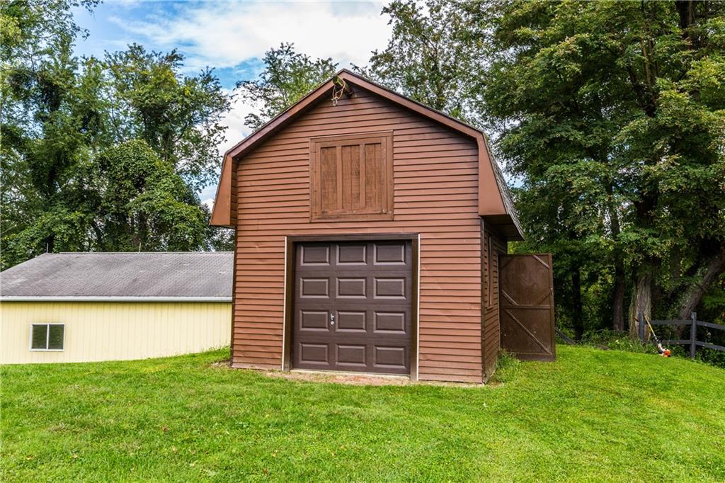 2045 McKees Rocks Road McKees Rocks, PA 15136 - Photo 23 of 25 16X14 barn shed with loft and garage door. All items inside of shed are for sale separately from the sale of the home.