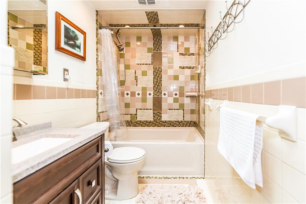 2045 McKees Rocks Road McKees Rocks, PA 15136 - Photo 10 of 25 Updated, full-bath with fantastic tiled tub and shower! Bath features skylight, new vanity, hardware, and toilet, and linen closet.