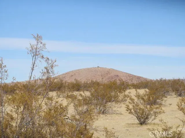 a view of mountain view with mountains in the background