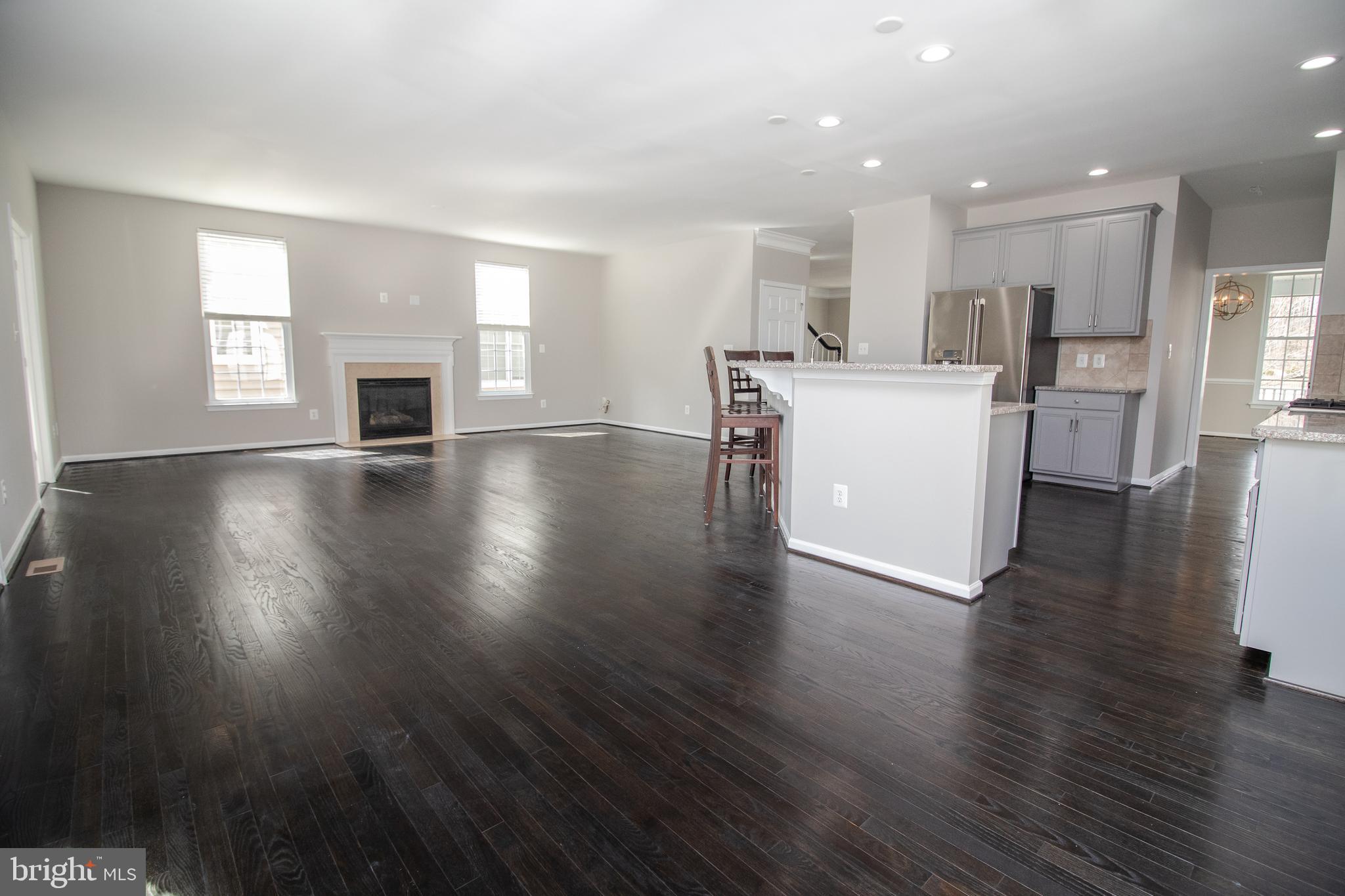 25257 Doolittle Lane Chantilly, VA 20152 - Photo 16 of 52 a view of kitchen with furniture and wooden floor