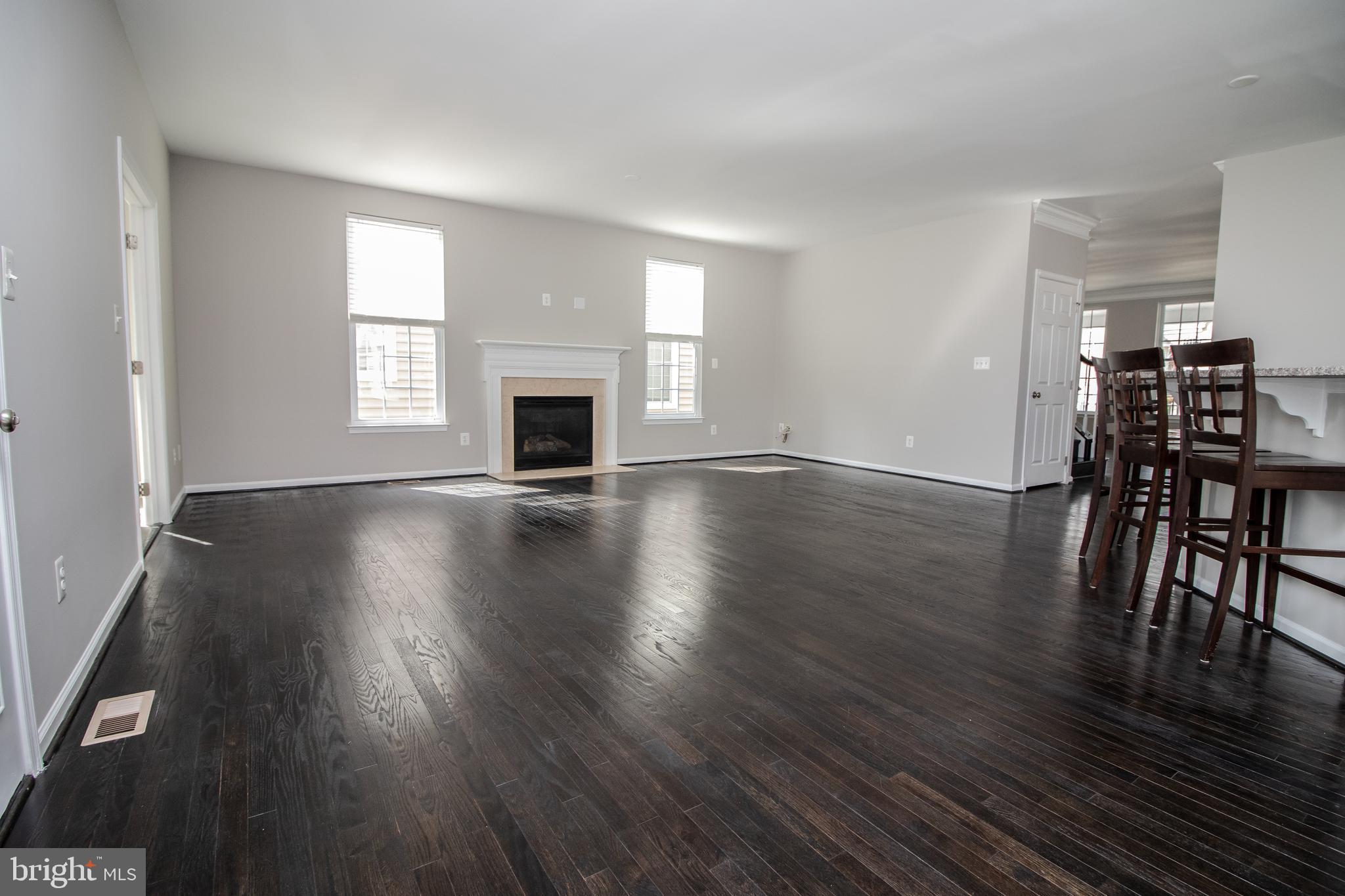25257 Doolittle Lane Chantilly, VA 20152 - Photo 17 of 52 a view of livingroom with furniture fireplace and wooden floor