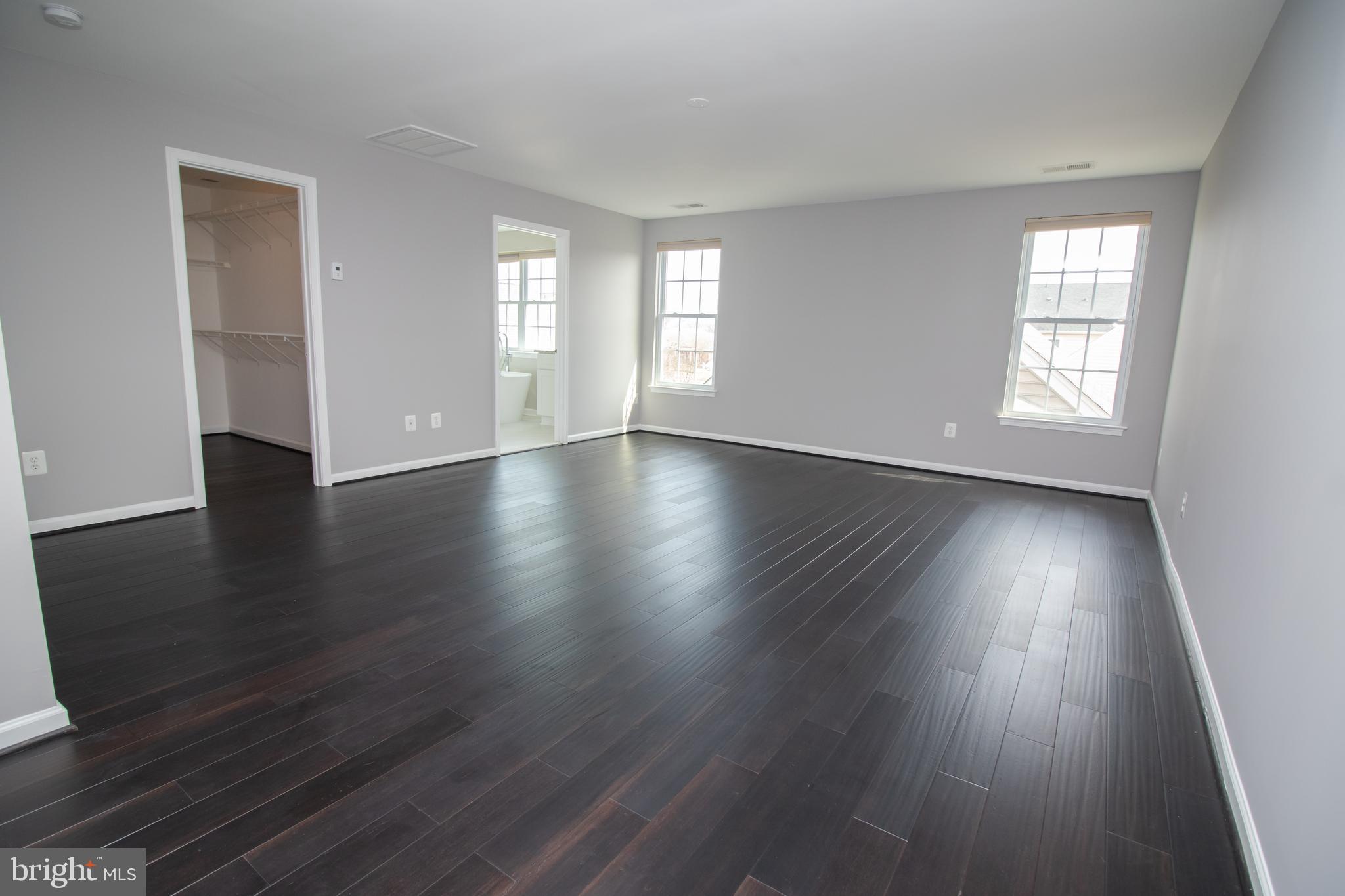 25257 Doolittle Lane Chantilly, VA 20152 - Photo 31 of 52 an empty room with wooden floor and windows