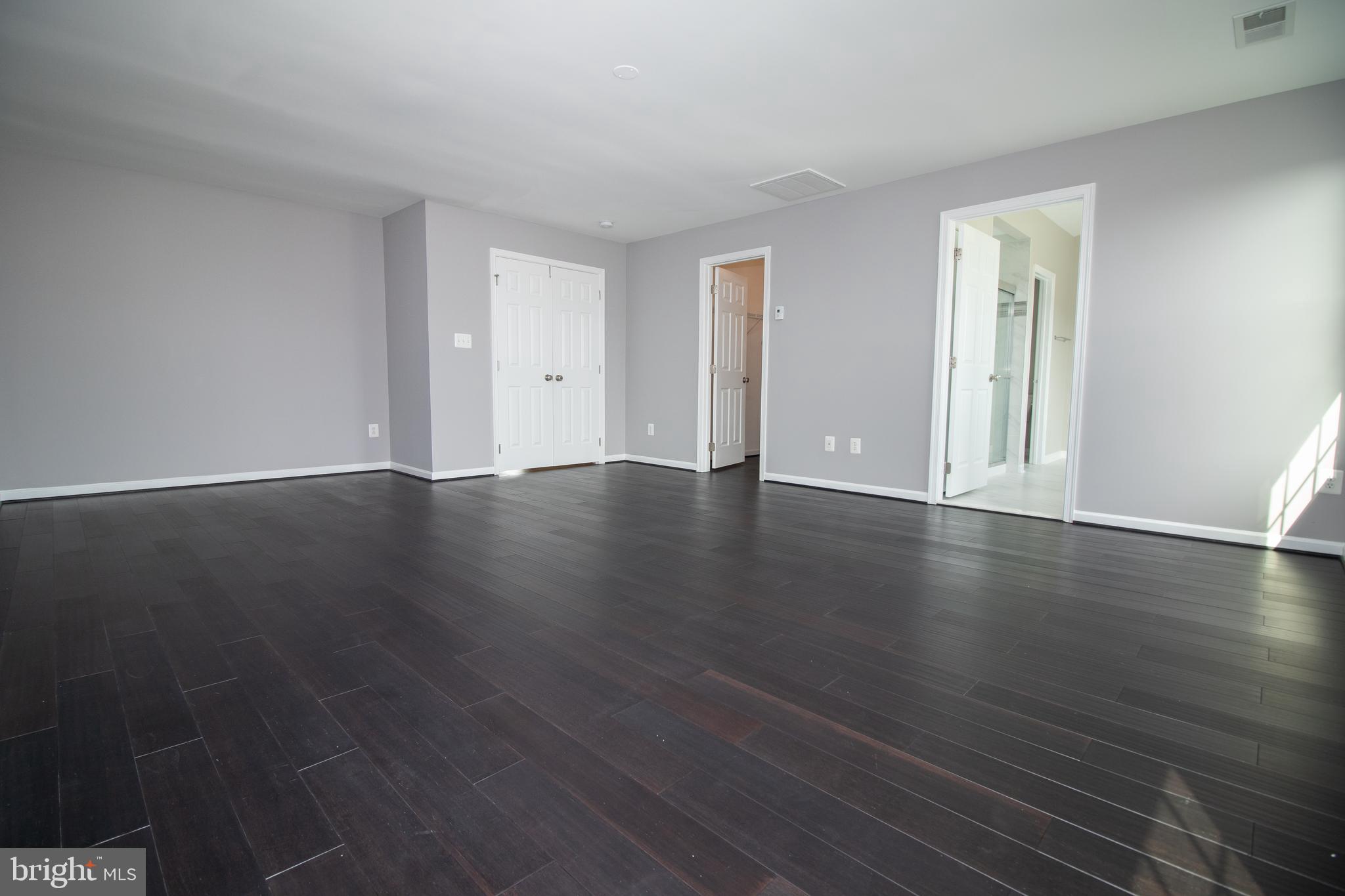 25257 Doolittle Lane Chantilly, VA 20152 - Photo 33 of 52 an empty room with wooden floor and windows