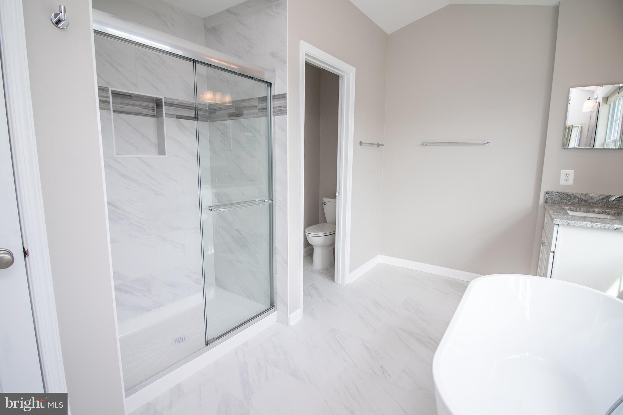 25257 Doolittle Lane Chantilly, VA 20152 - Photo 39 of 52 a bathroom with a bathtub and a shower